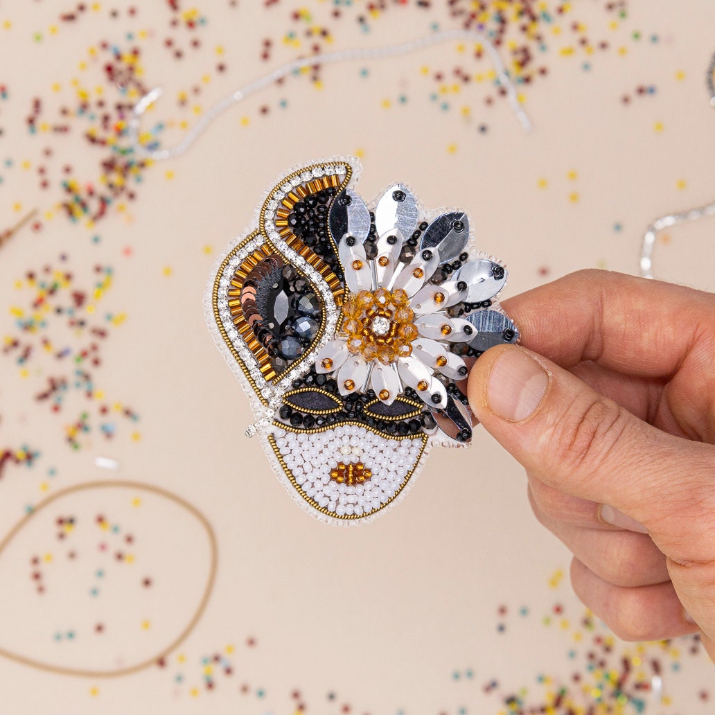 a person's hand with a ring on it